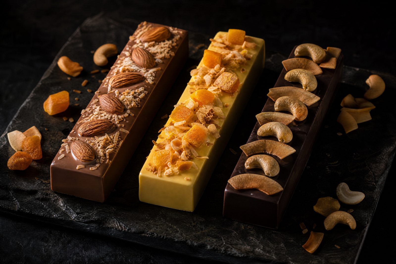 Three variations of the Coconut Cashew bar, each with a different base or topping